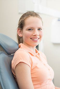 Young girl in dental chair