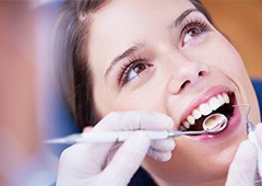 Woman receiving dental exam