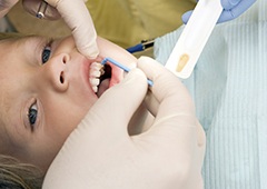 Child receving fluoride treatment