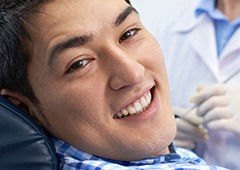 Smiling man in dental chair