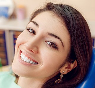 Smiling woman in a dental chair
